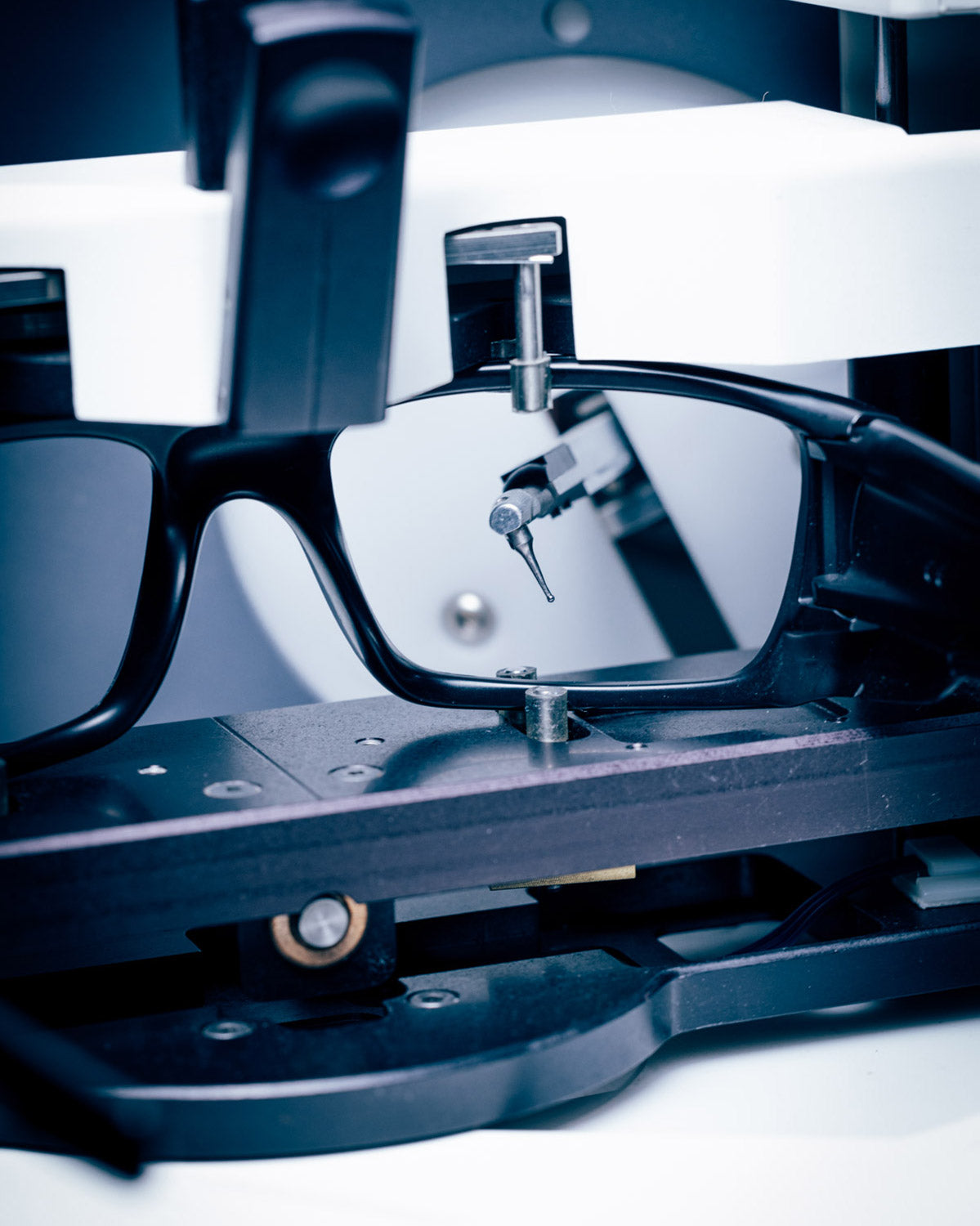 A pair of sunglasses being traced to make custom replacement lenses