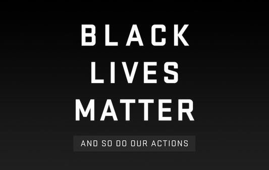 Black Lives Matter message in bold white letters on a dark gradient background
