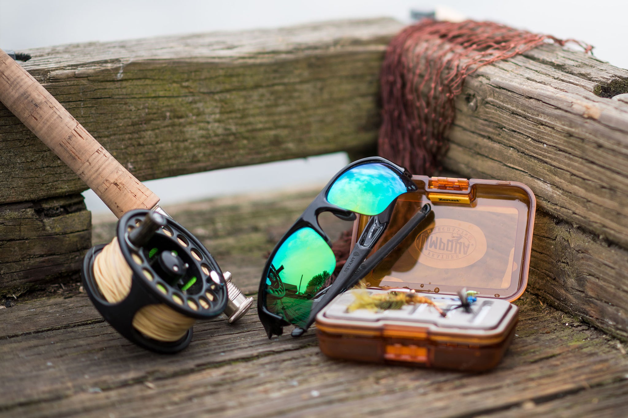 Oakley Flak Jacket XLJ sunglasses with Emerald Green lenses and fishing gear