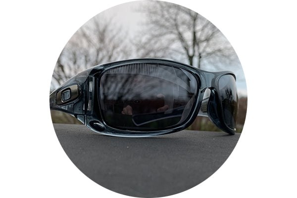 View of Black Chrome lenses on an overcast day sitting on a flat surface