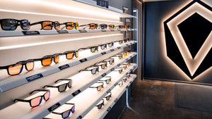 Revant Optics show room with a variety of frames and lens colors displayed on the wall.