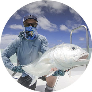 Customer image of a man holding a large saltwater fish. 
