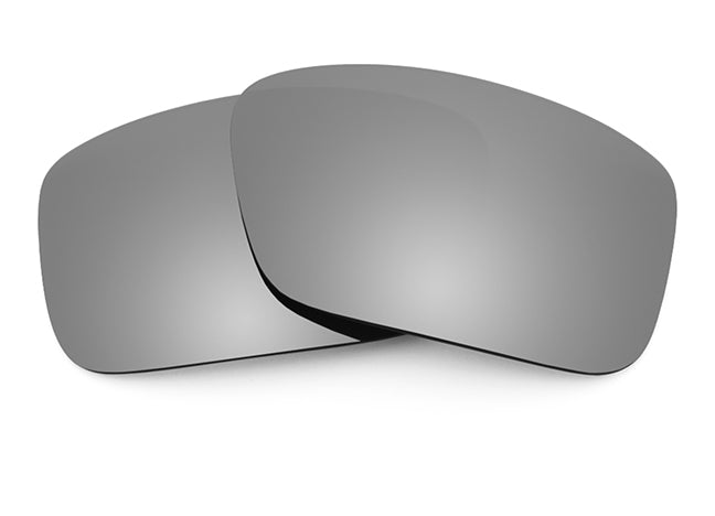 Two Titanium mirrored Sunglass lenses laid on top of each other.
