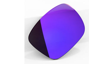 One Plasma Purple sunglass lens with mirrorshield leaning on a white wall.