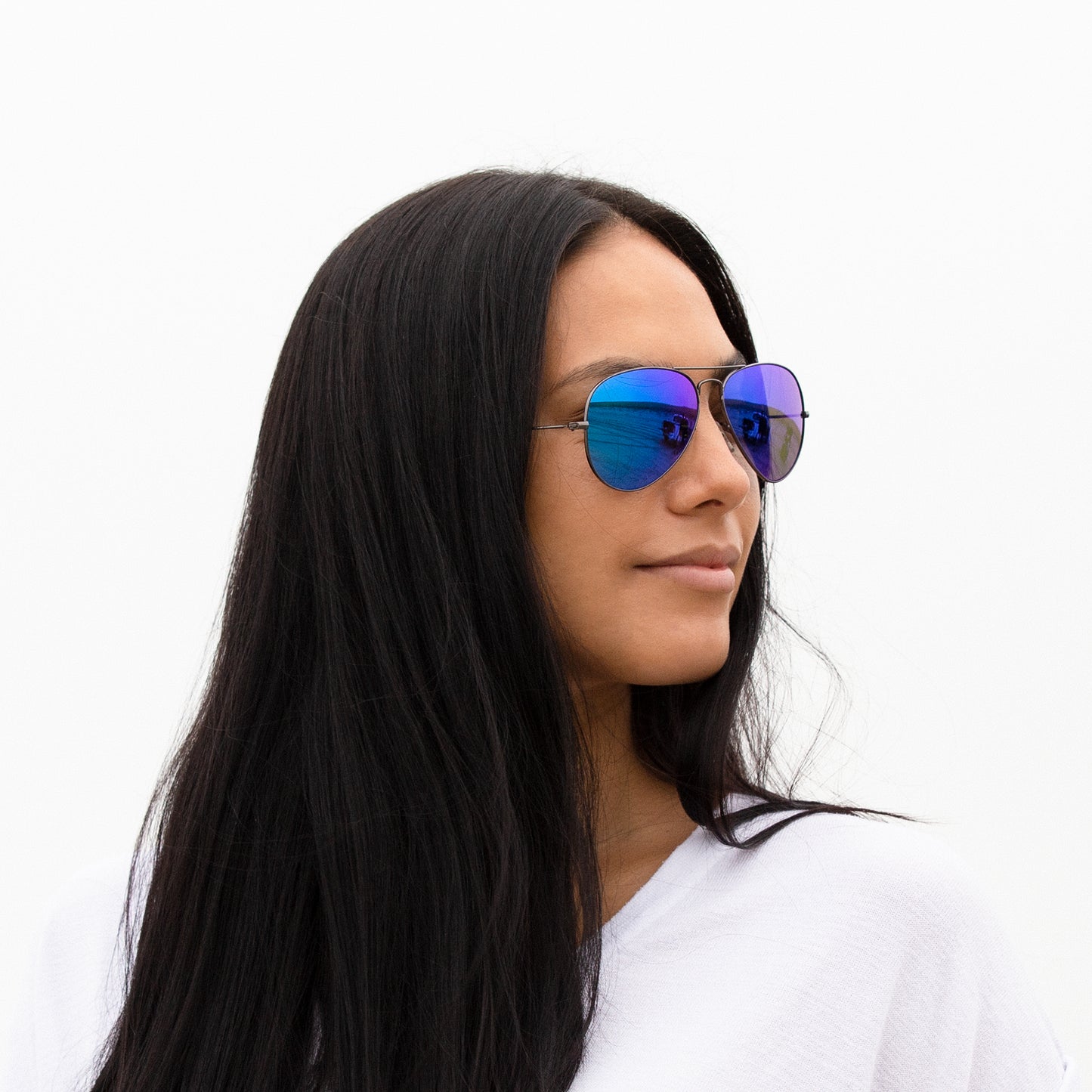 A person wearing sunglasses with Non-Polarized Ice Blue lenses installed in the frame