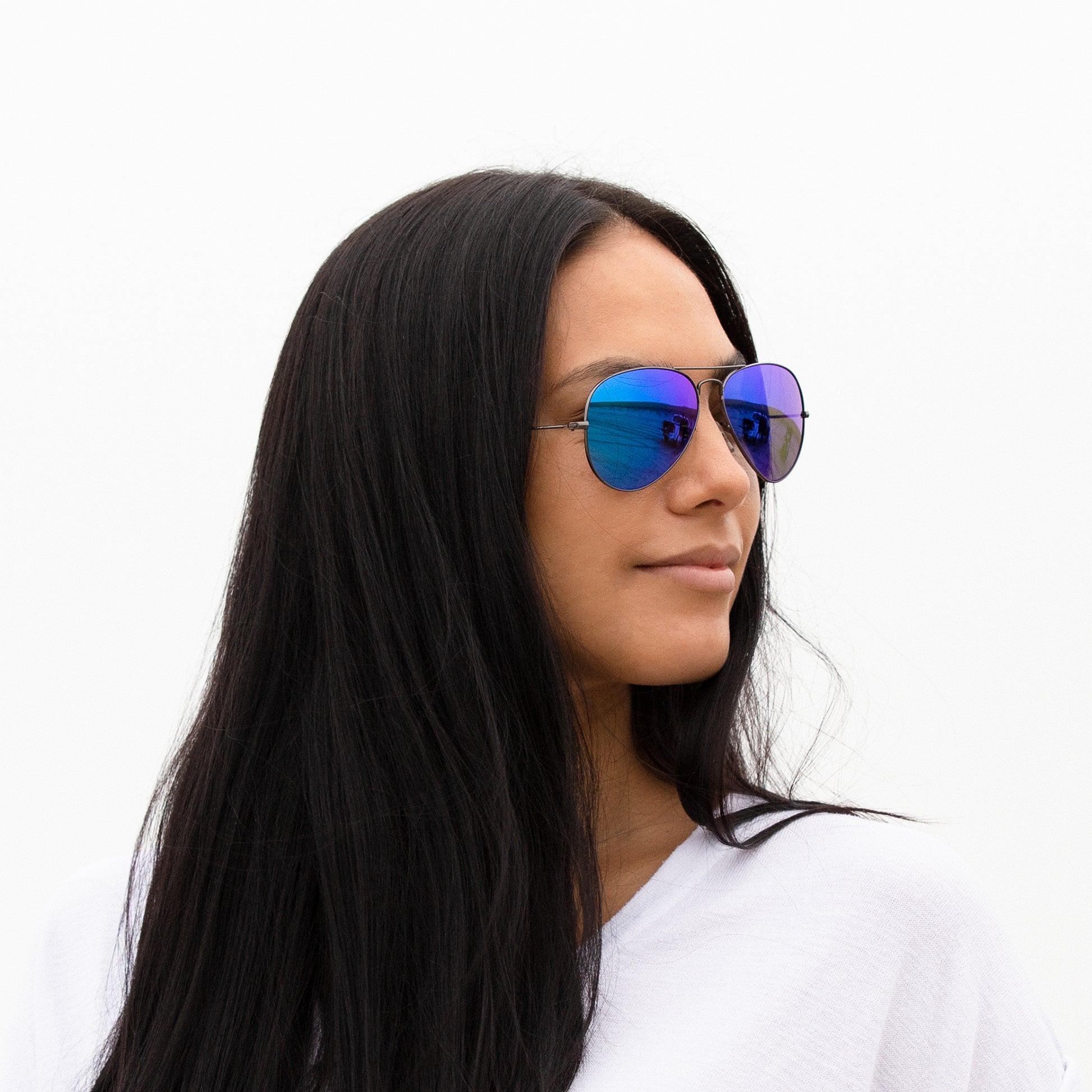 A person wearing sunglasses with Non-Polarized Ice Blue lenses installed in the frame