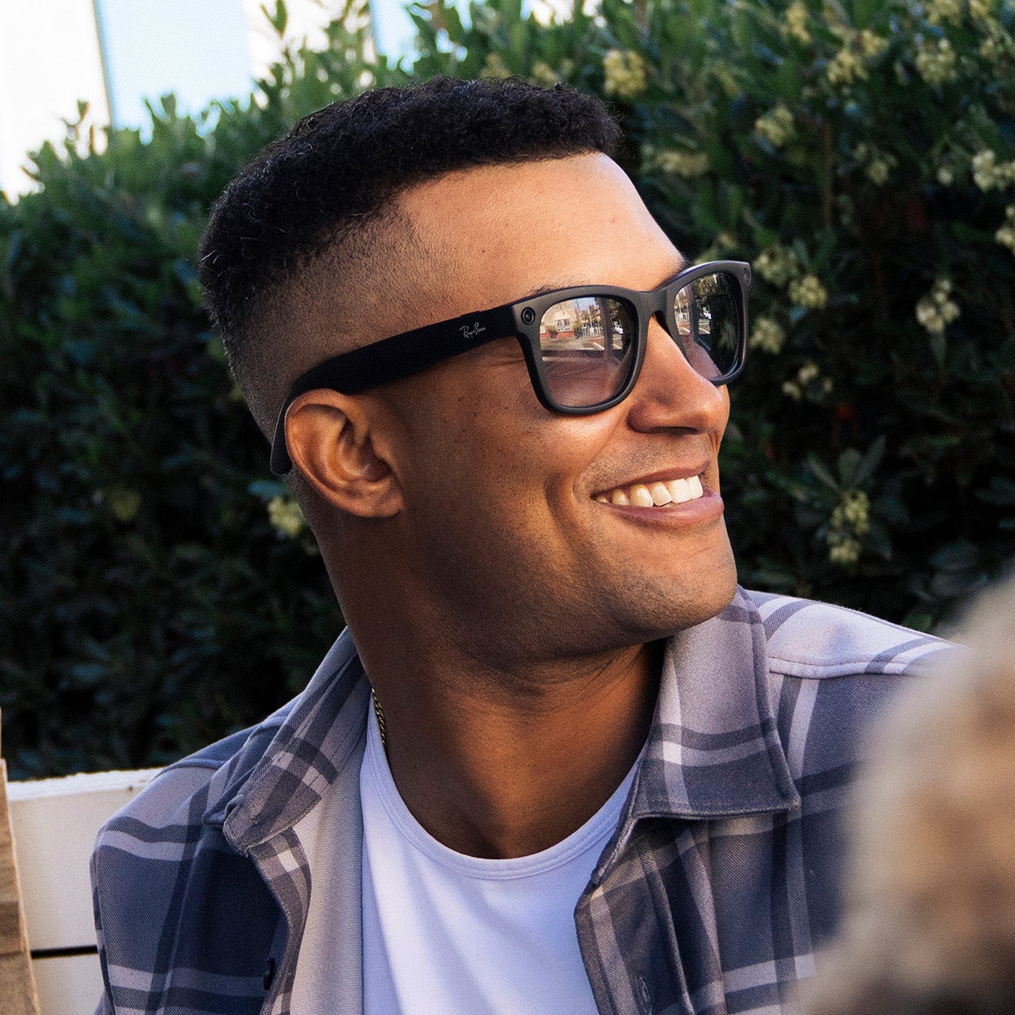 a person wearing sunglasses with adapt gray photochromic lenses