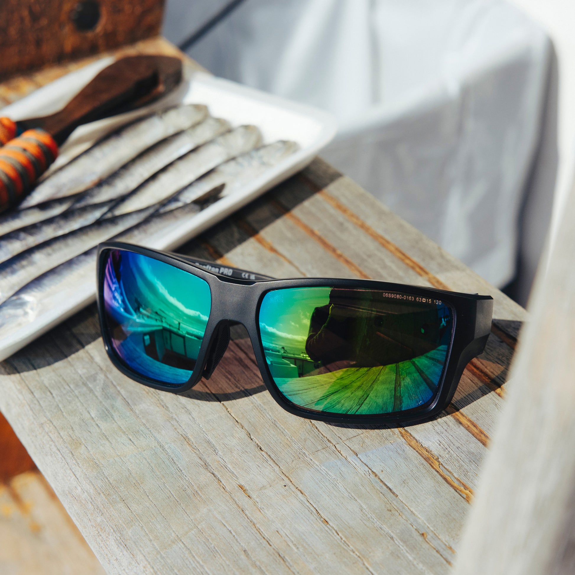 a person wearing sunglasses with emerald green lenses