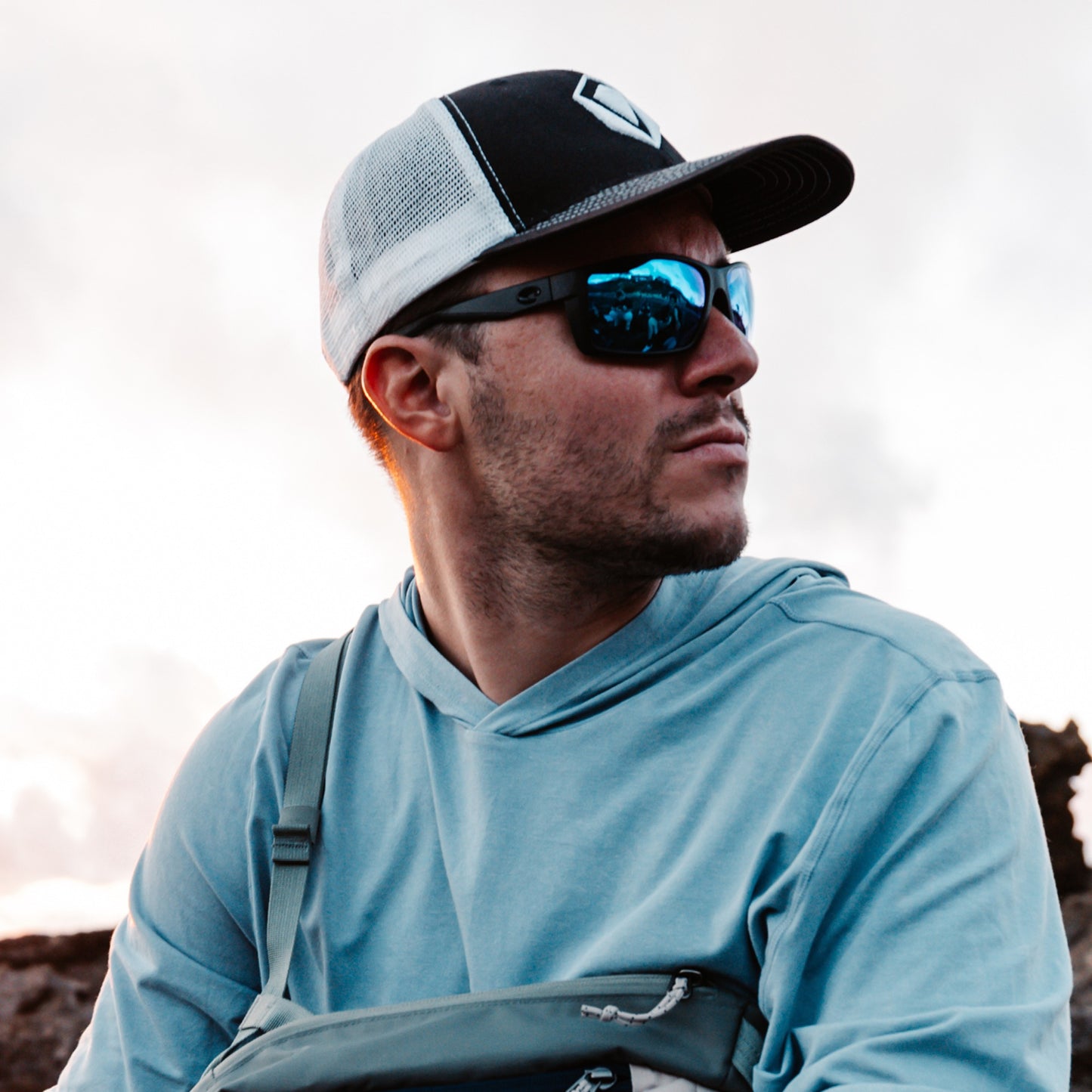 a person wearing sunglasses with tidal blue lenses