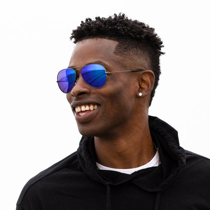 A person wearing sunglasses with Polarized Tidal Blue lenses installed in the frame